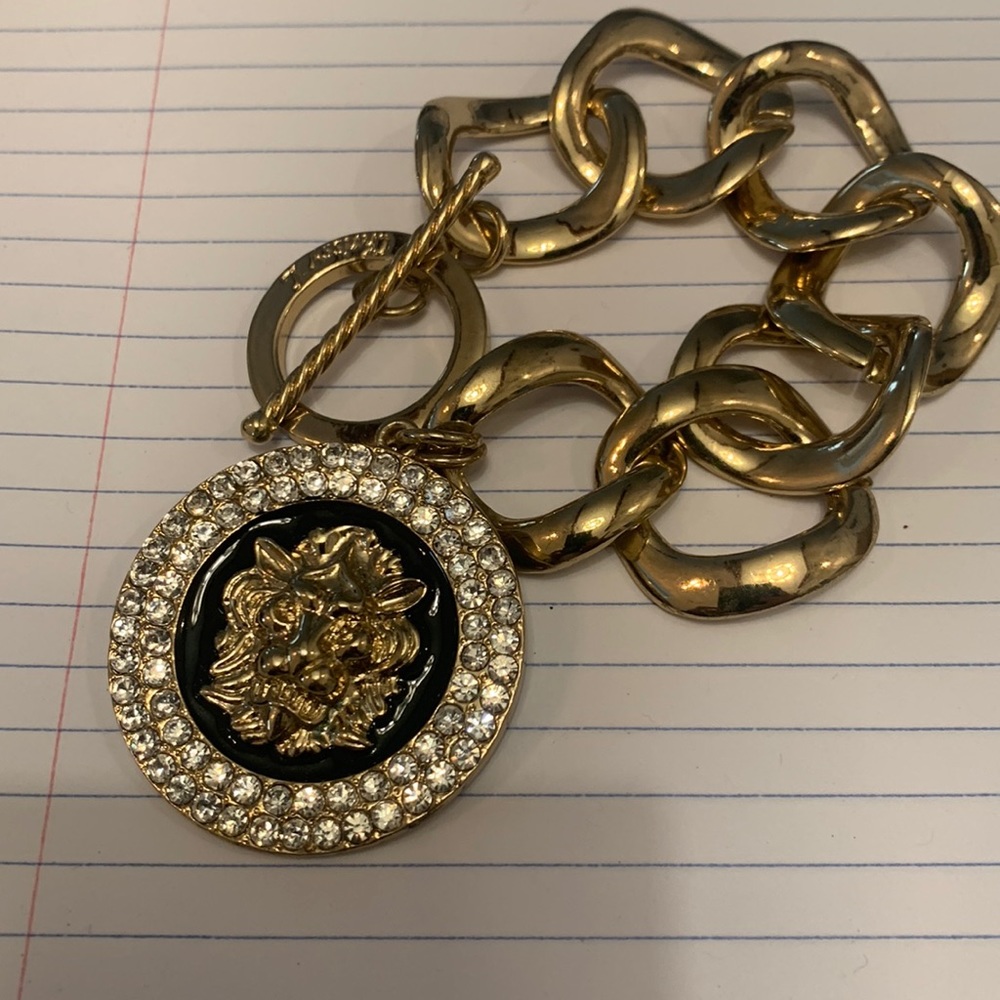 Heavy 70’s style lion large link charm bracelet in gold with clear crystals.